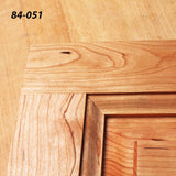 Close-up of unfinished wooden cabinet door corner showing precise joinery detail