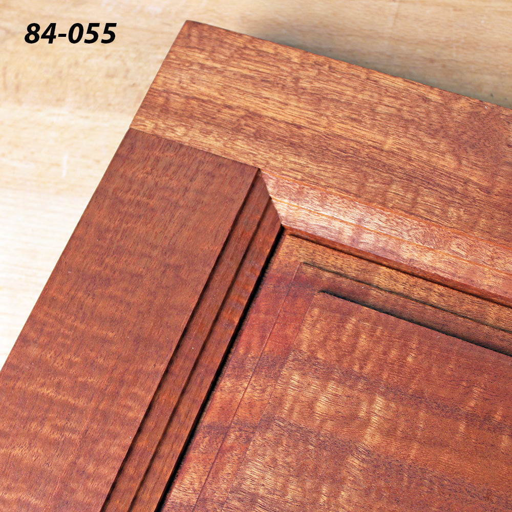 Close-up of a wooden cabinet door corner with decorative routered edge profile, SKU 84-055.