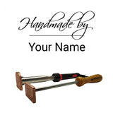 Custom woodworking branding irons with 'Handmade by Your Name' engraving, isolated on white background.