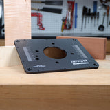 Router table insert plate with measurement markings on wooden workbench in woodworking shop