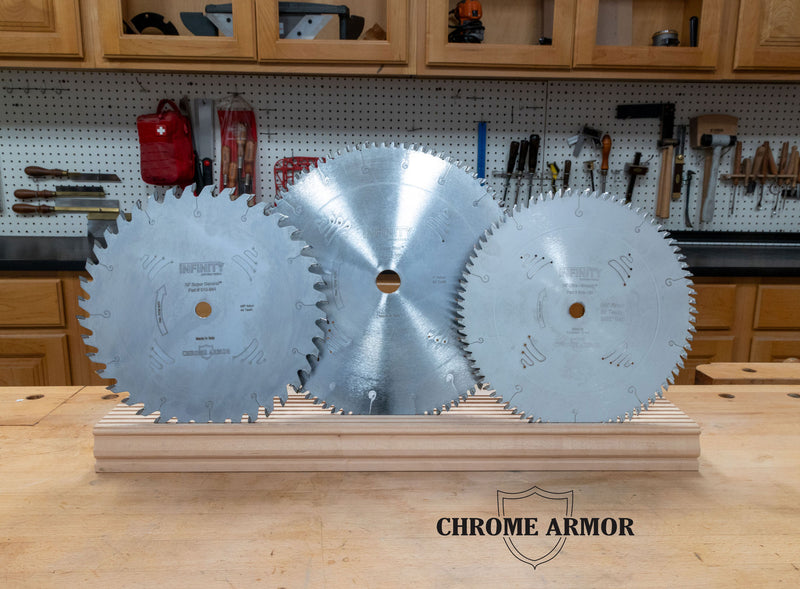 Three circular saw blades on a stand with a workshop background, featuring the 'Chrome Armor' brand.