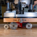 Slot cutter arbor with router and bearings on a wooden workbench for woodworking tools