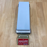Cerax 1000 ceramic sharpening whetstone on wooden surface, ideal for woodworking tools.