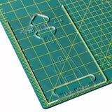 Acrylic quilting template with lighthouse cutout on a green cutting mat with yellow grid lines