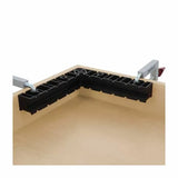 Corner clamping jig securing two wooden boards for precise woodworking assembly