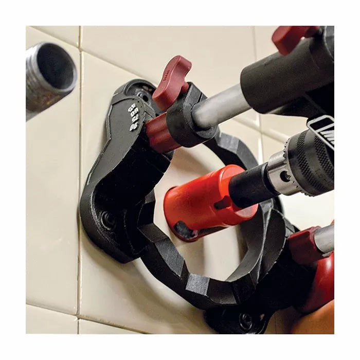 Tile hole saw guide used with drill and hole saw on ceramic wall tiles