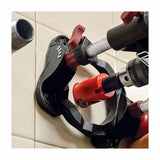 Tile hole saw guide used with drill and hole saw on ceramic wall tiles