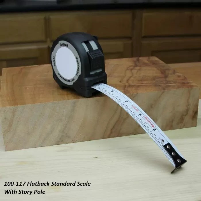 Flatback measuring tape with story pole on wood block, woodworking tool in workshop setting