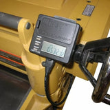 Digital planer gauge with LCD readout attached to woodworking machine