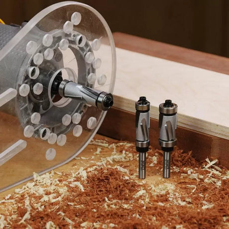 Woodworking router with two spiral router bits on a workbench with wood shavings