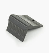 Black aluminum woodworking jig accessory with grooved surface on a white background