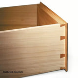Close-up of a wooden drawer corner with rabbeted dovetail joinery for woodworking.