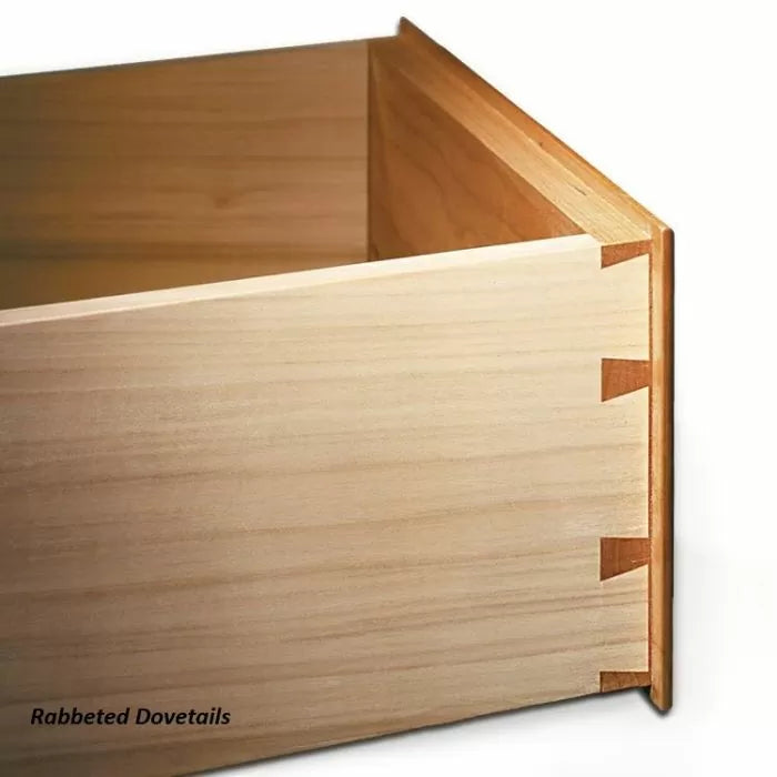 Close-up of rabbeted dovetail joints on a wooden drawer corner for woodworking precision.