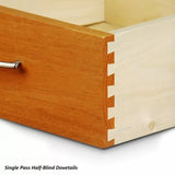 Close-up of single pass half-blind dovetail joints on a wooden drawer with metal handle