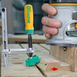 Woodworker using router and dovetail clamp on angle-marked wood, precision woodworking tools