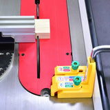 Table saw with a crosscut sled, wood block, and precision dado jig in use