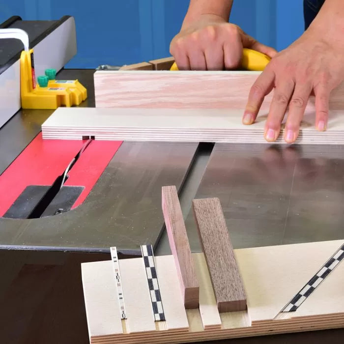Woodworker using table saw with sled and push block for precise wood cutting.