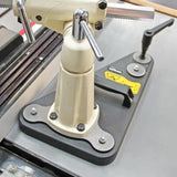 Precision woodworking tool clamp and adjustable saw guide on a workshop table