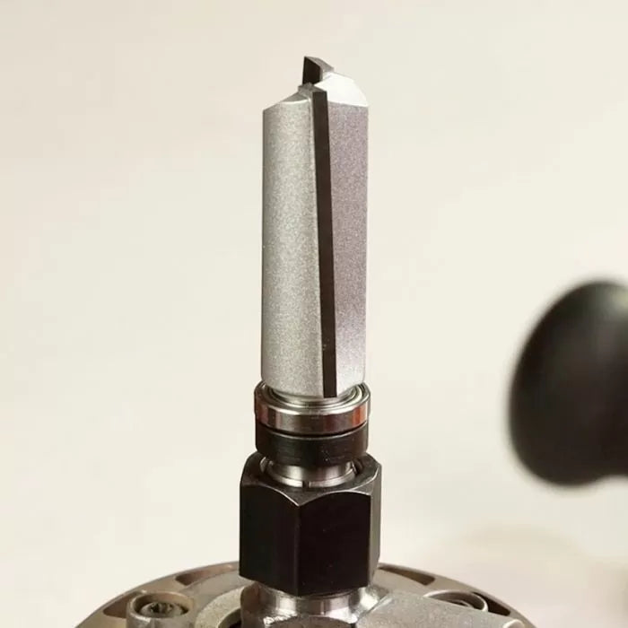 Straight carbide router bit mounted in a router tool for woodworking precision cuts