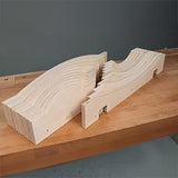 Stacked woodworking curve templates on a wooden workbench for precise routing and cutting