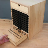 Wood dado blade storage box with labeled sliding drawers for woodworking tools.