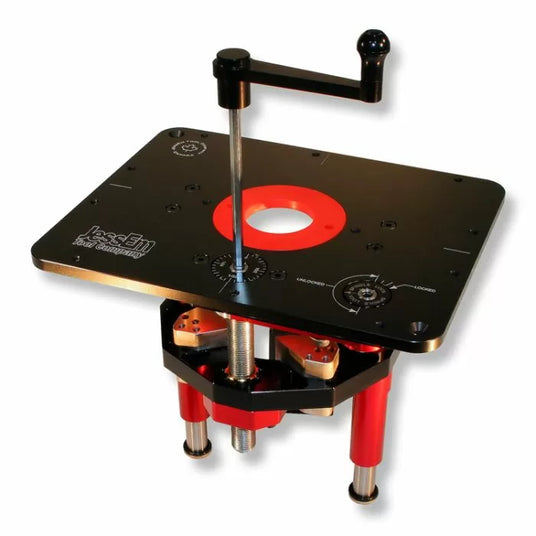 Router lift with crank handle for precision woodworking, black plate and red accents.
