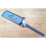 Japanese-style pull saw with ergonomic handle and blade sleeve, on a wood workbench