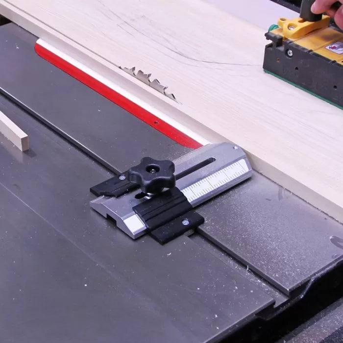 Precision table saw with miter gauge and push block cutting wood for woodworking projects