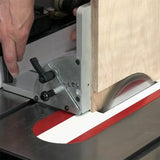Table saw crosscut sled guiding plywood board for precise woodworking cuts